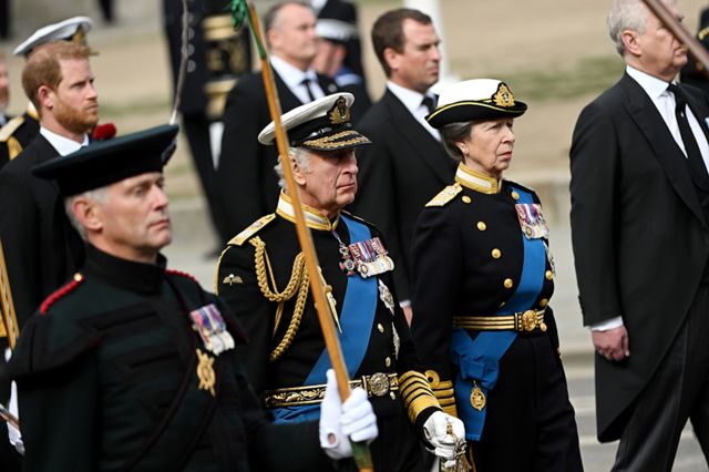 King Charles III and Anne, Princess Royal follow behind The Queen's funeral cortege borne on the State Gun Carriage of the Royal Navy as it leaves Westminster Abbey on September 19, 2022 in London